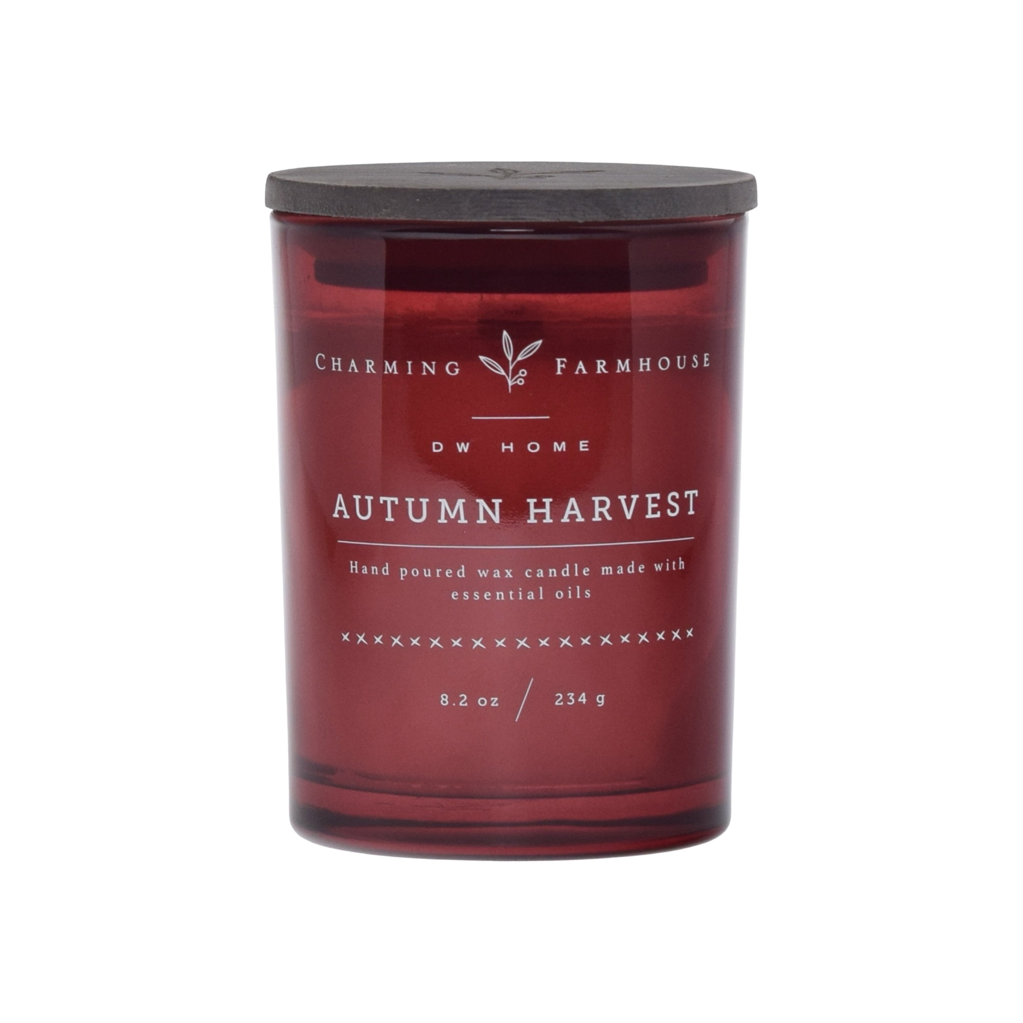 Red candle with 'Charming Farmhouse' label on a dark red background