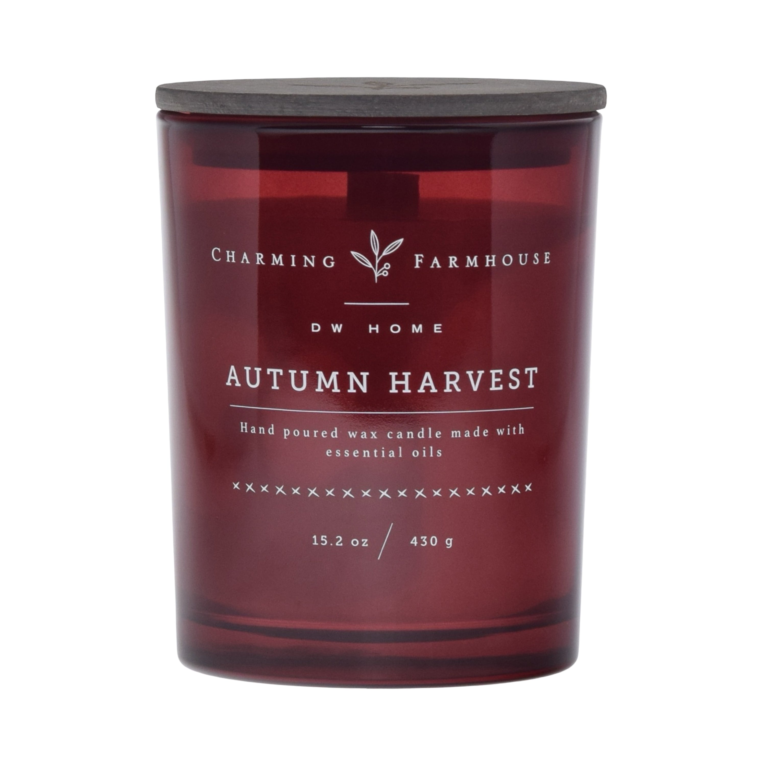 Autumn Harvest candle with Charming Farmhouse branding on a dark red background