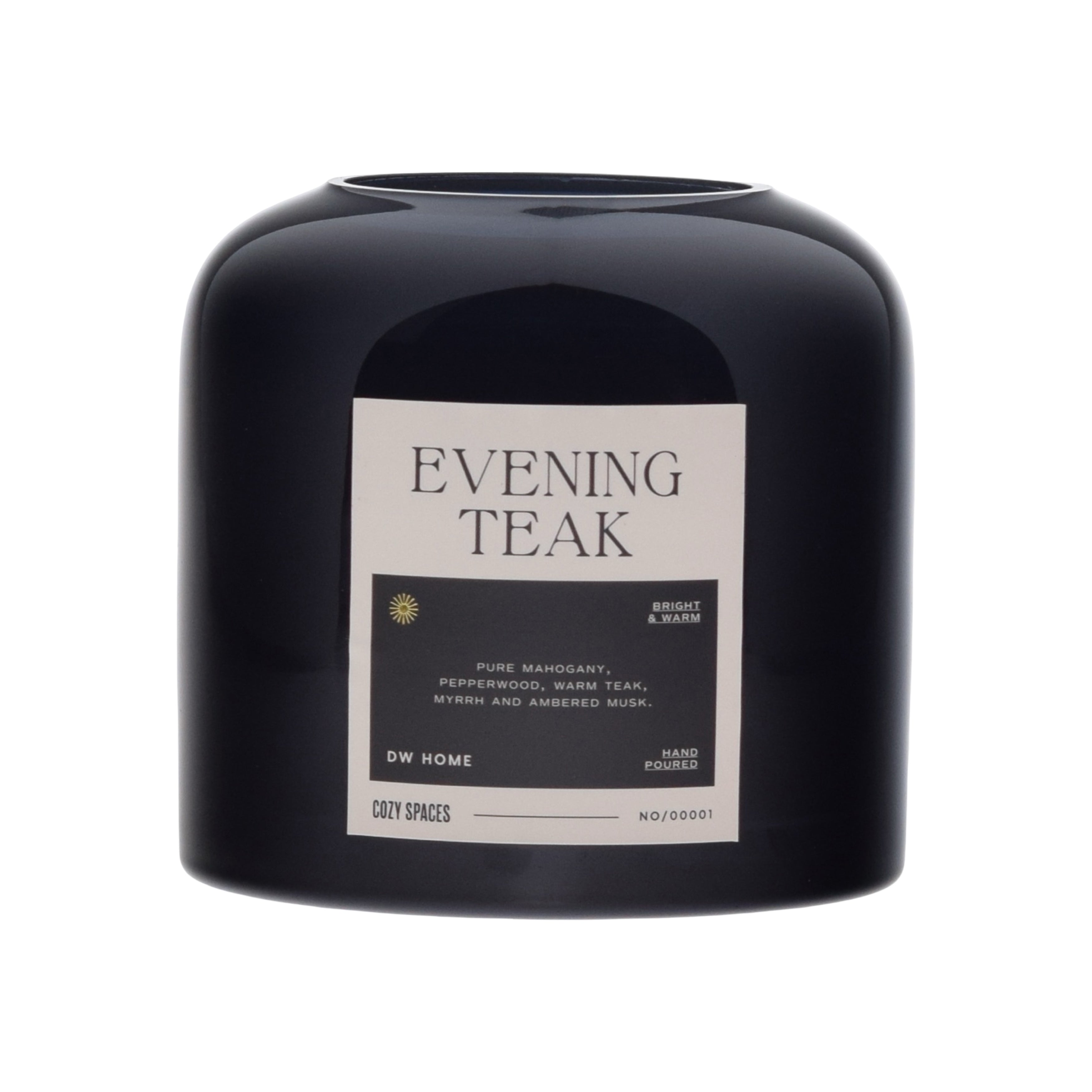 Black candle labeled 'Evening Teak' by DW Home on a white background