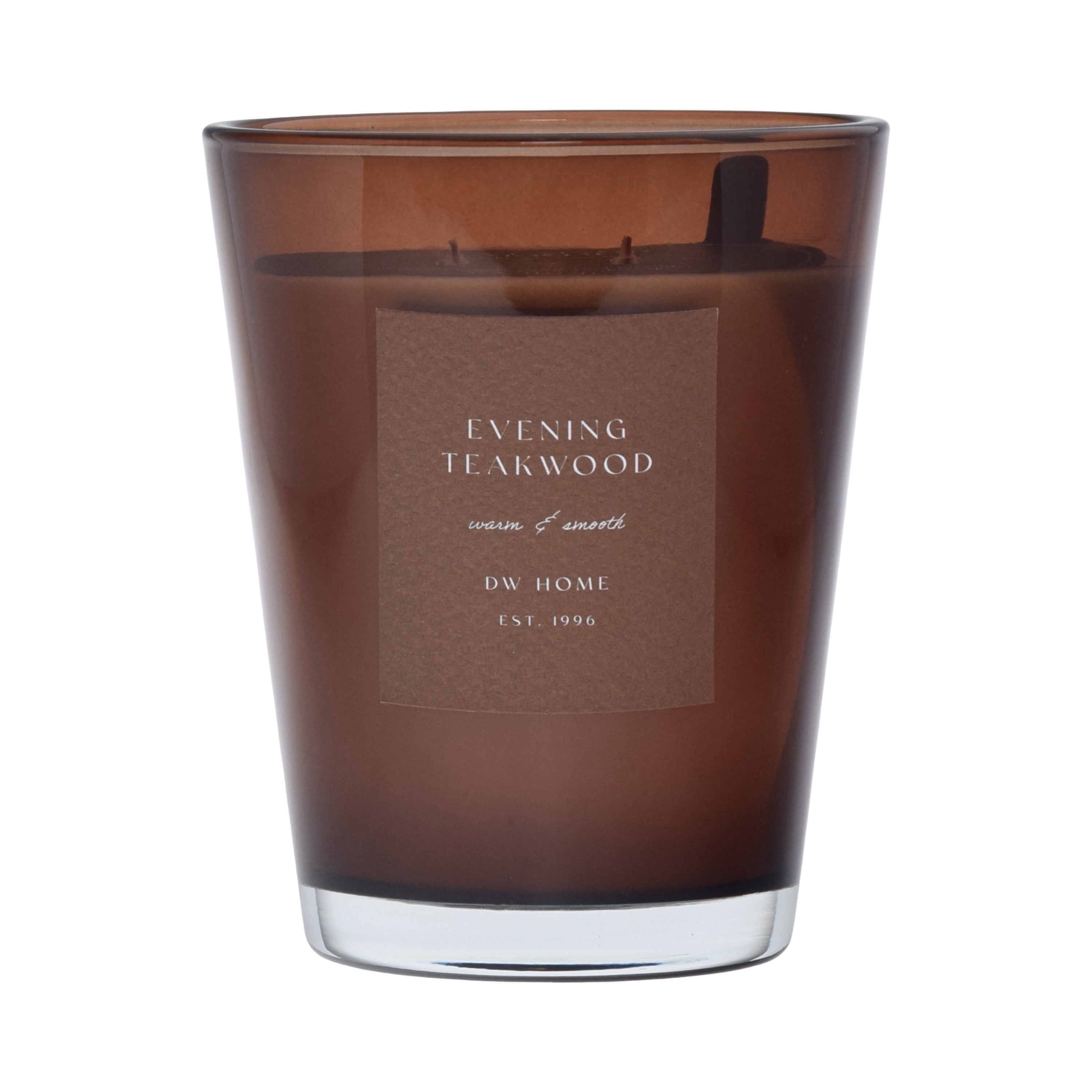 Brown DW Home candle with 'Evening Teakwood' label on a brown background