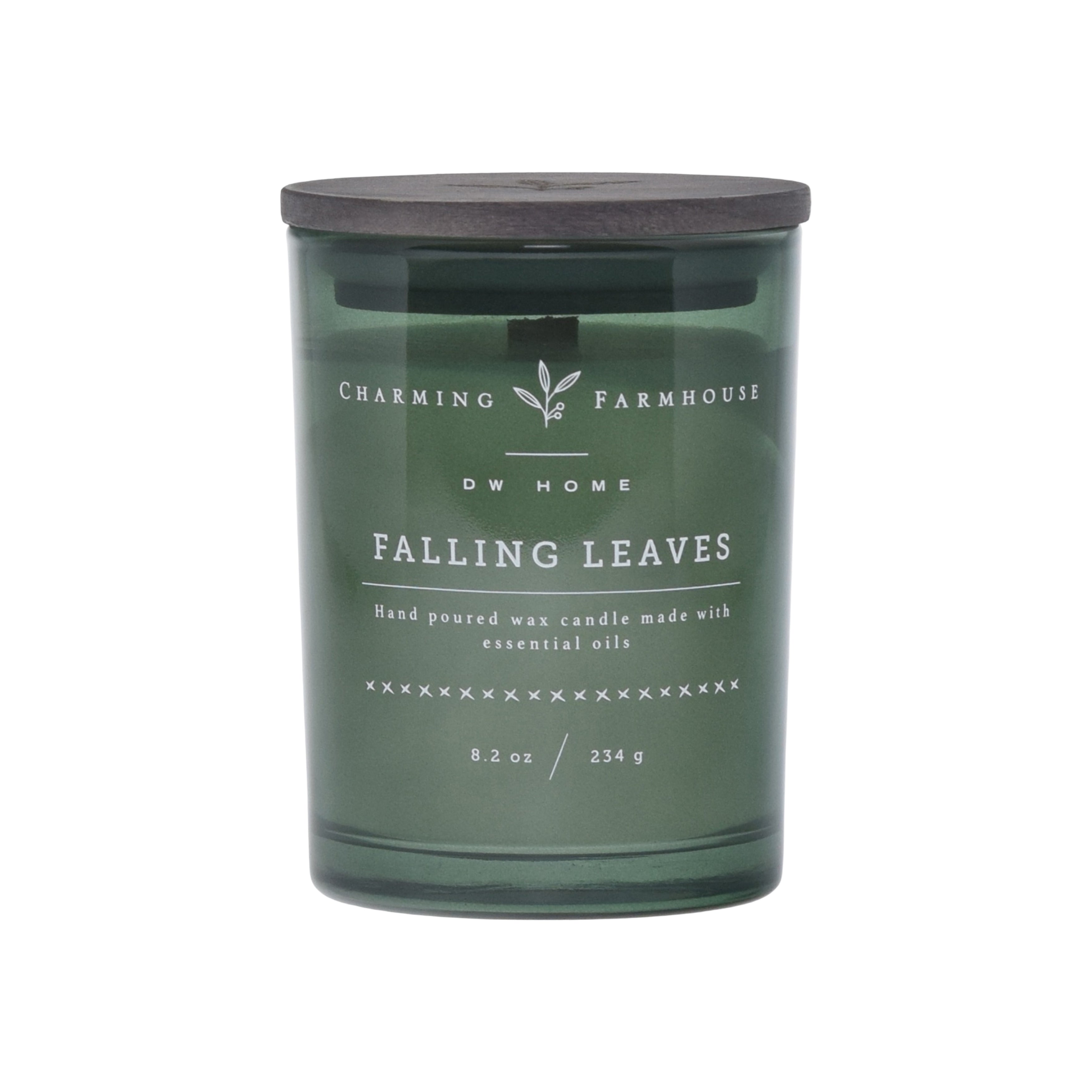 Green candle labeled 'Falling Leaves' by Charming Farmhouse on a green background