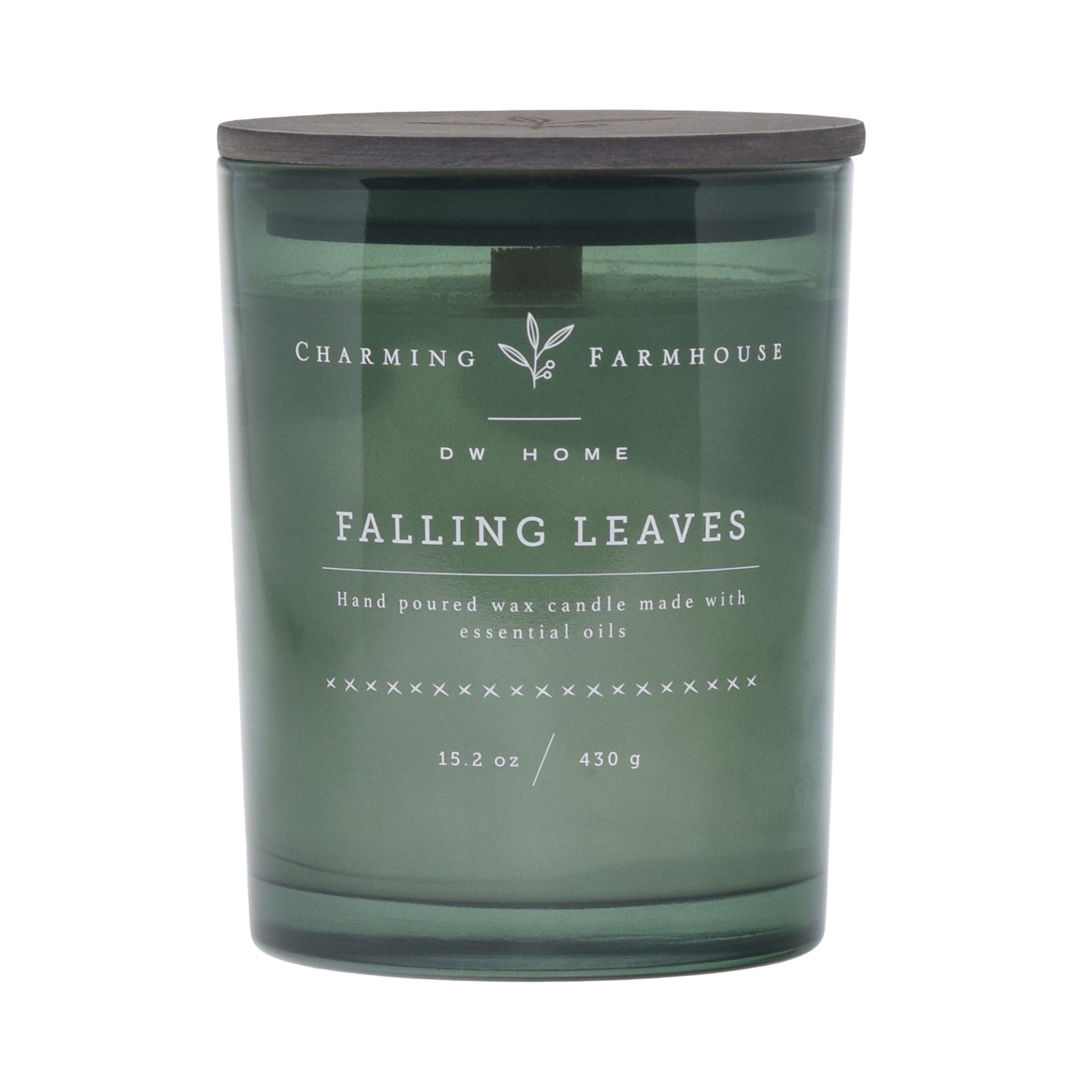 Green candle labeled 'Falling Leaves' by Charming Farmhouse on a green background