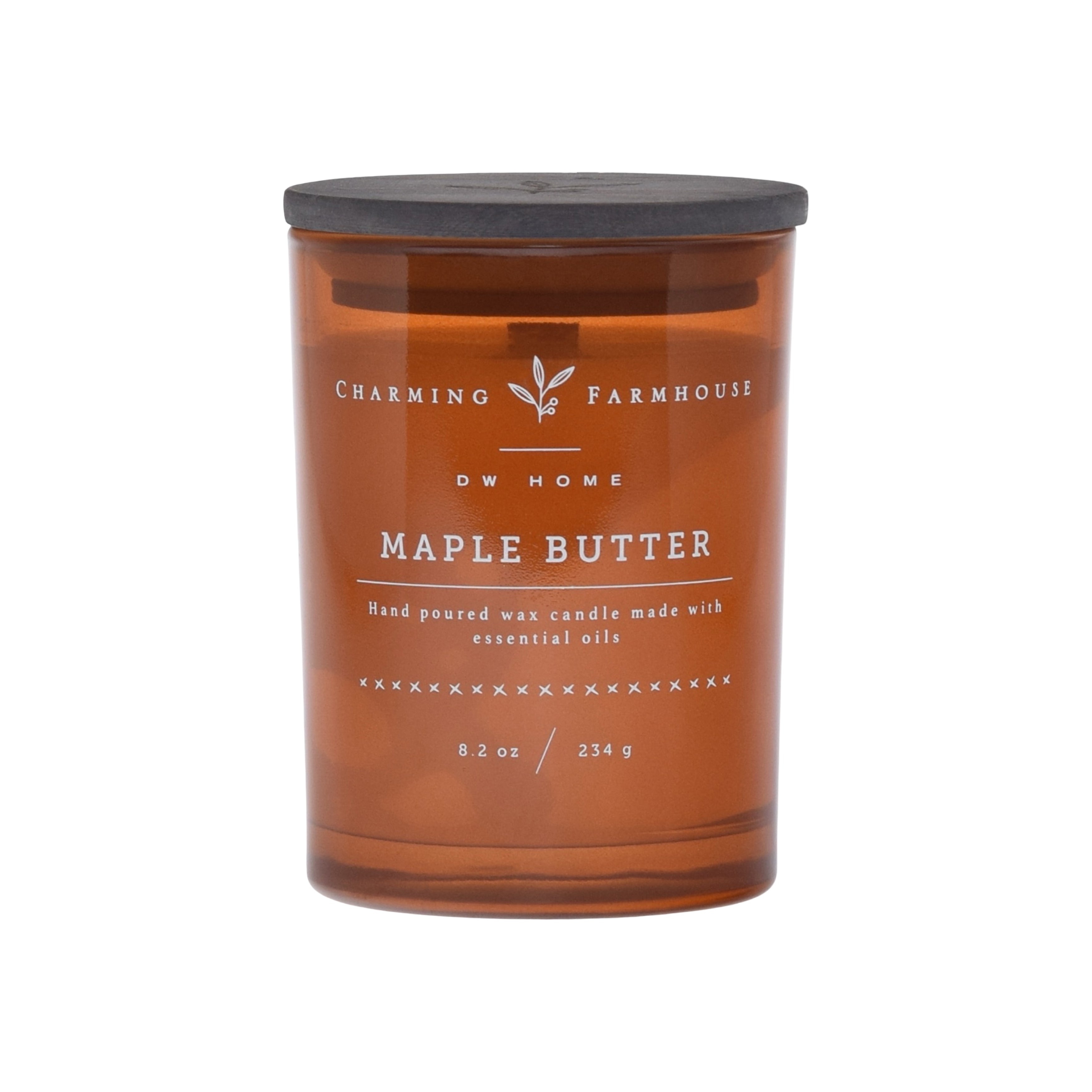 Amber colored candle jar with 'Charming Farmhouse' label on an amber background
