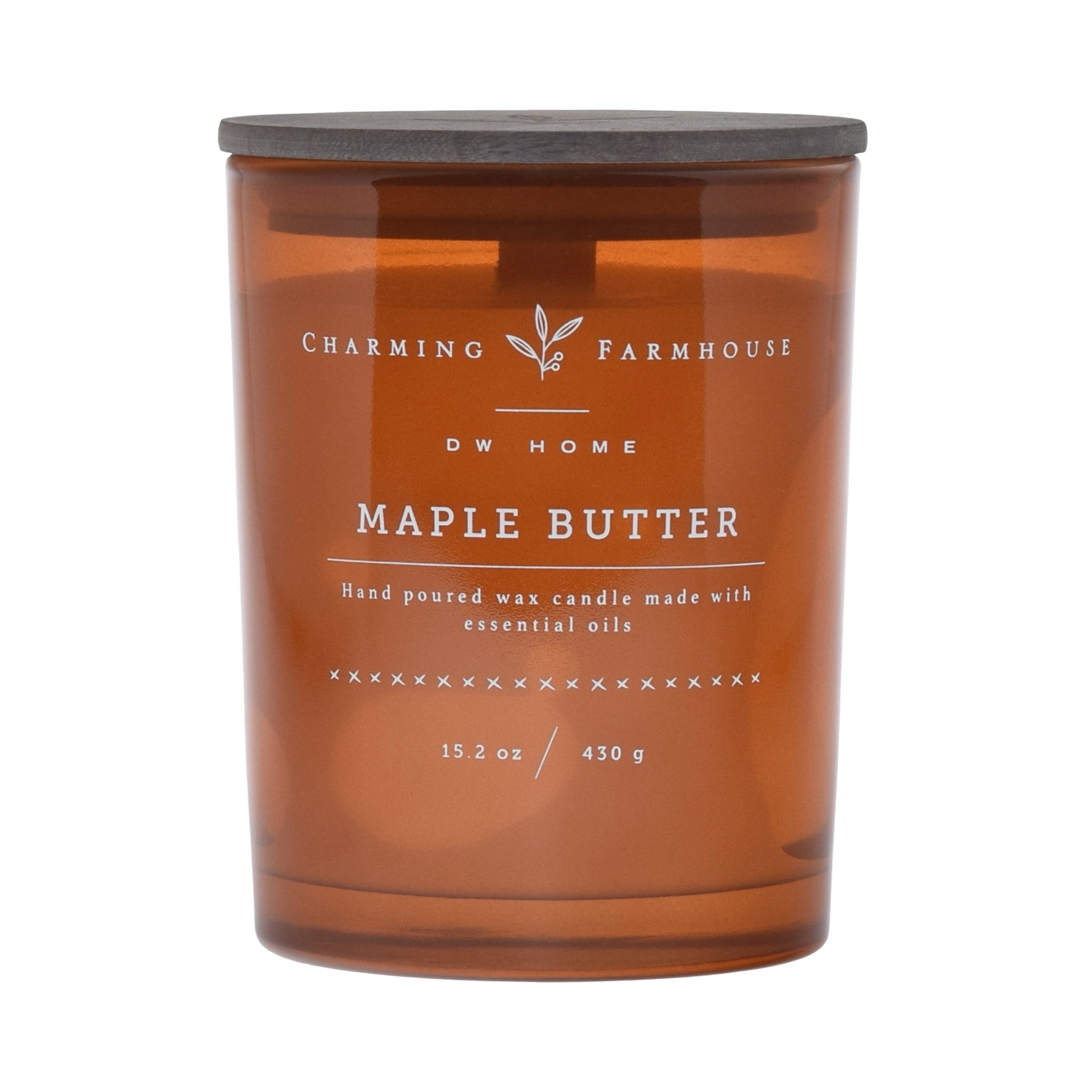 Amber candle jar with 'Charming Farmhouse' label on an amber background