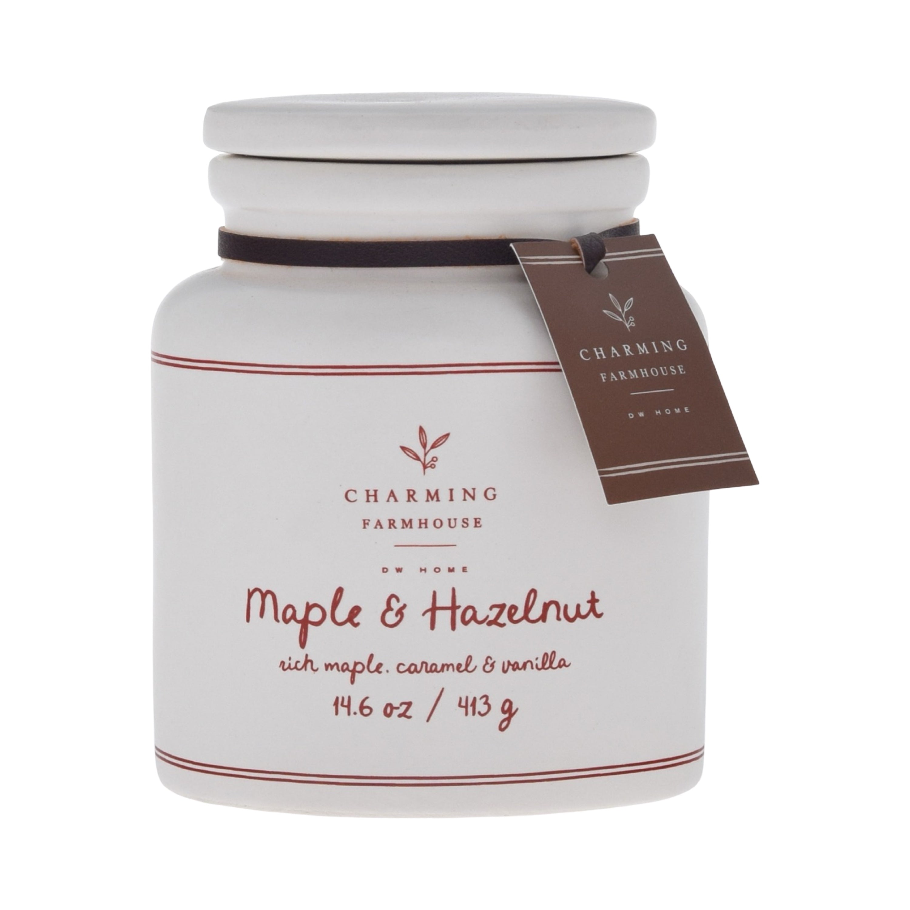 White candle jar with 'Charming Farmhouse' label and 'Maple & Hazelnut' description on a white background