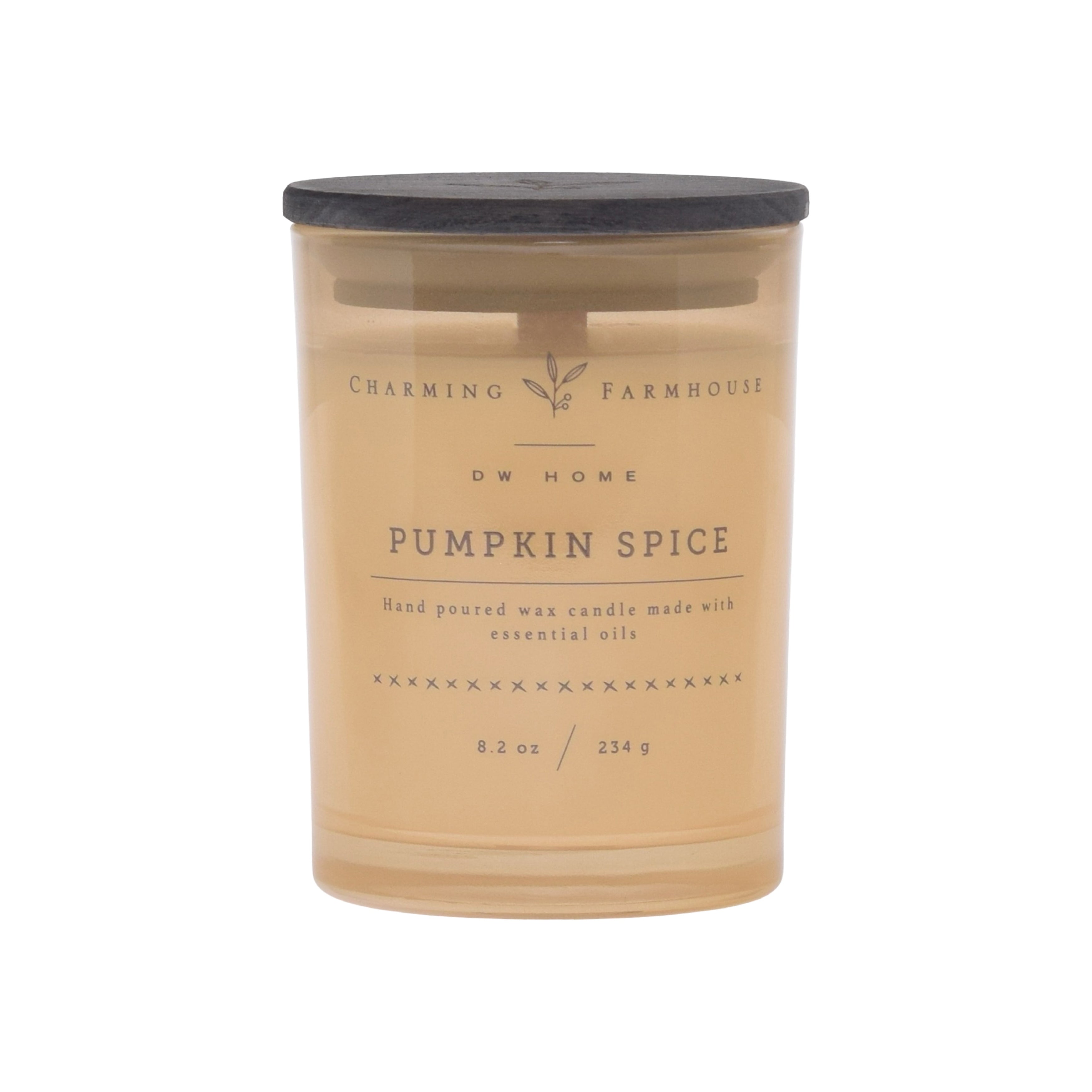 Pumpkin spice candle with a label on a cream background