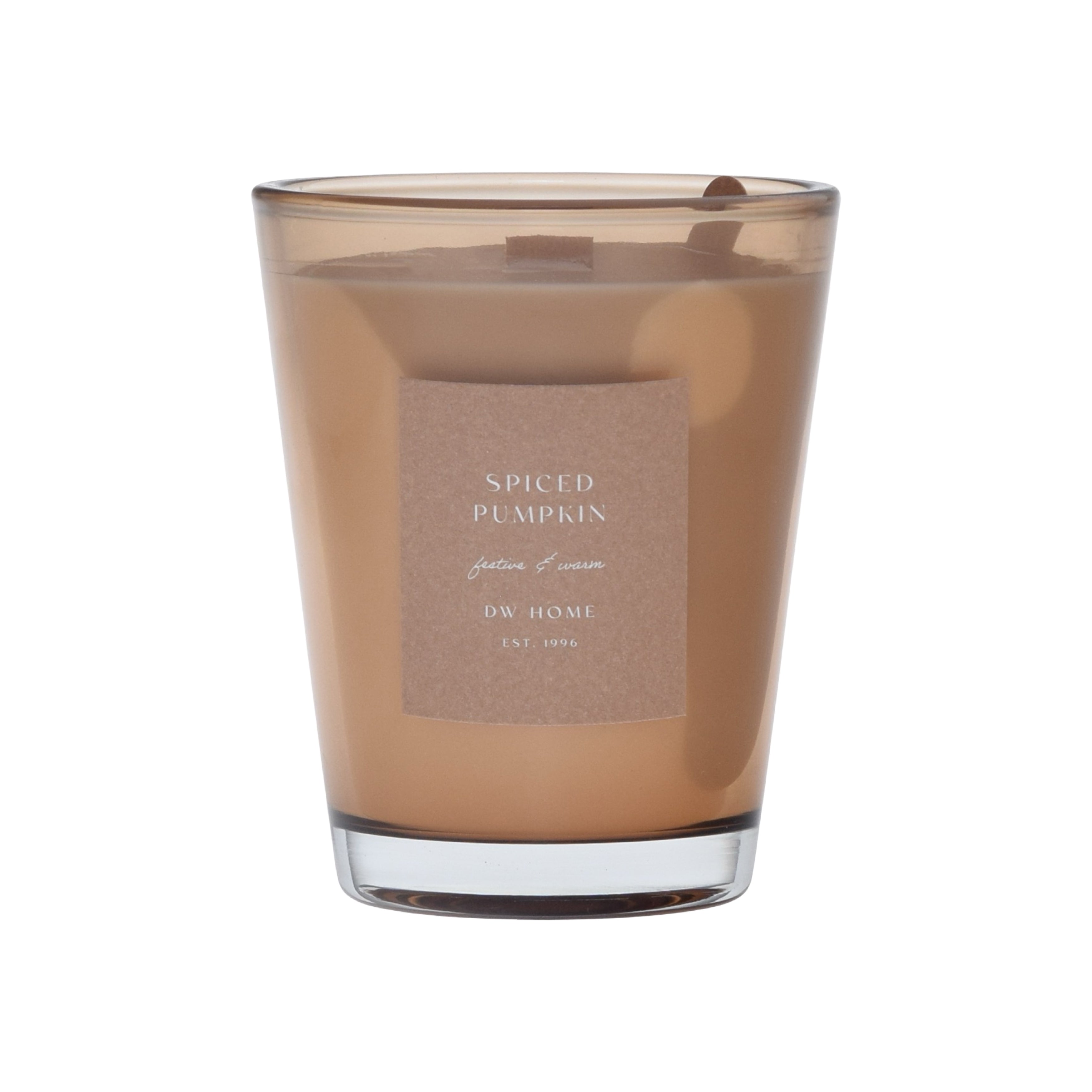 Brown vase candle in a glass container with a label on a brown background